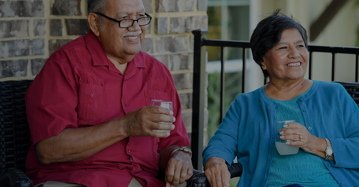 Diabetic couple sits outside enjoying a sunny day