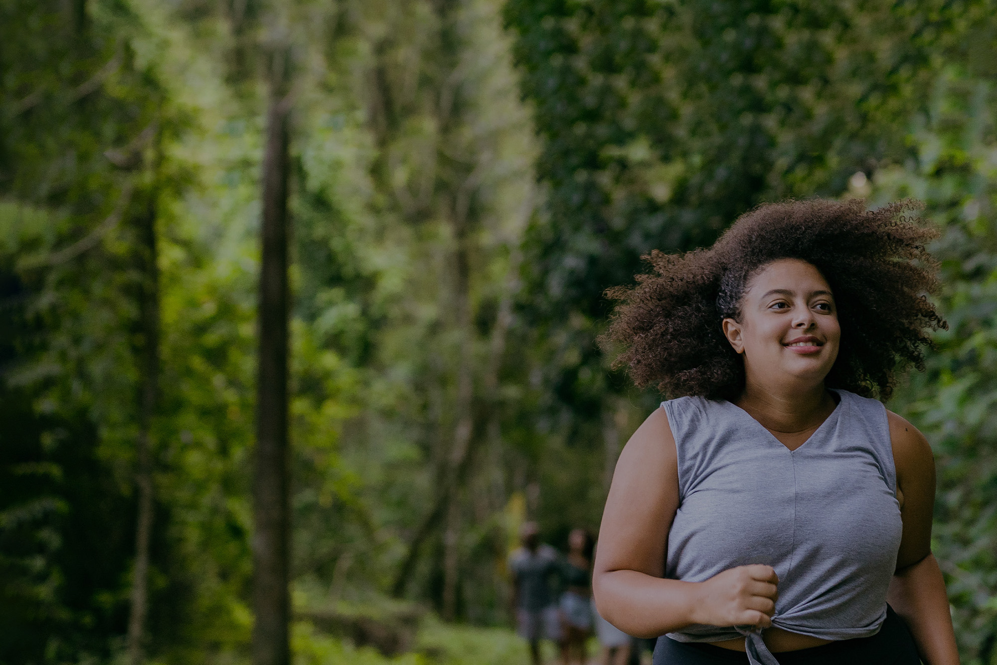 Woman running outdoors on a trail